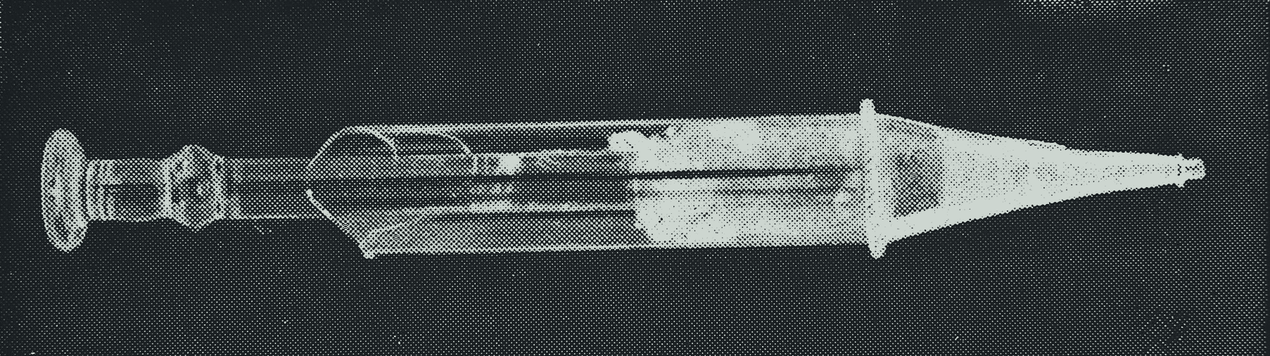 Photograph of an early glass hypodermic syringe with a tapered metal tip, belonging to Dr. Alexander Wood, with its printed caption cropped away
